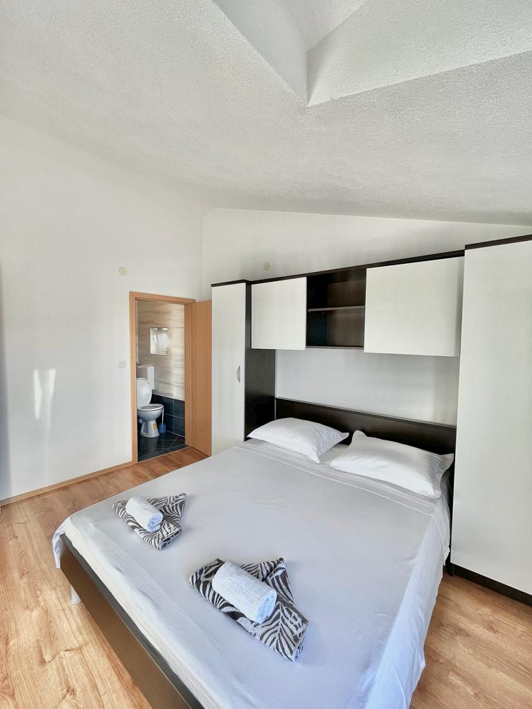 master bedroom with a toilet