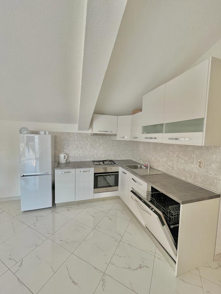 modern white kitchen with a washing maschine