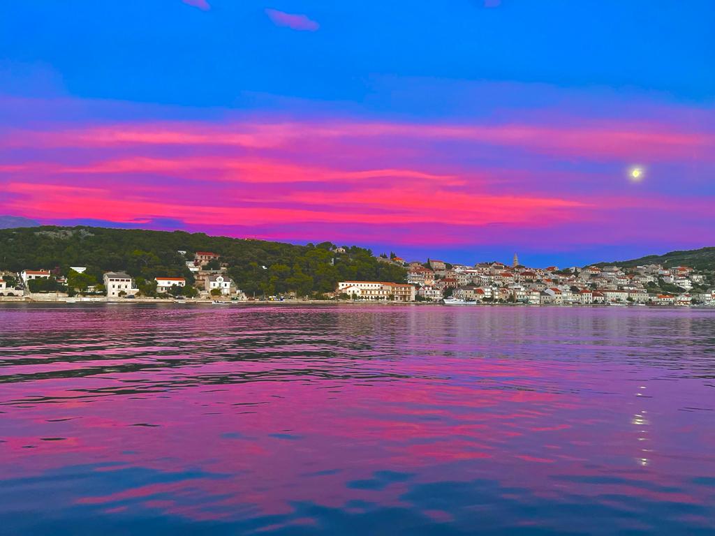 red and blu: sunset on the sea in Povlja on the island of Brač